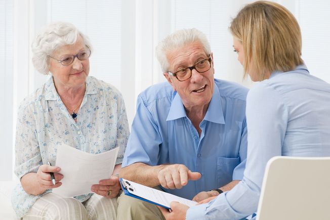 An elderly couple having a client consultation
