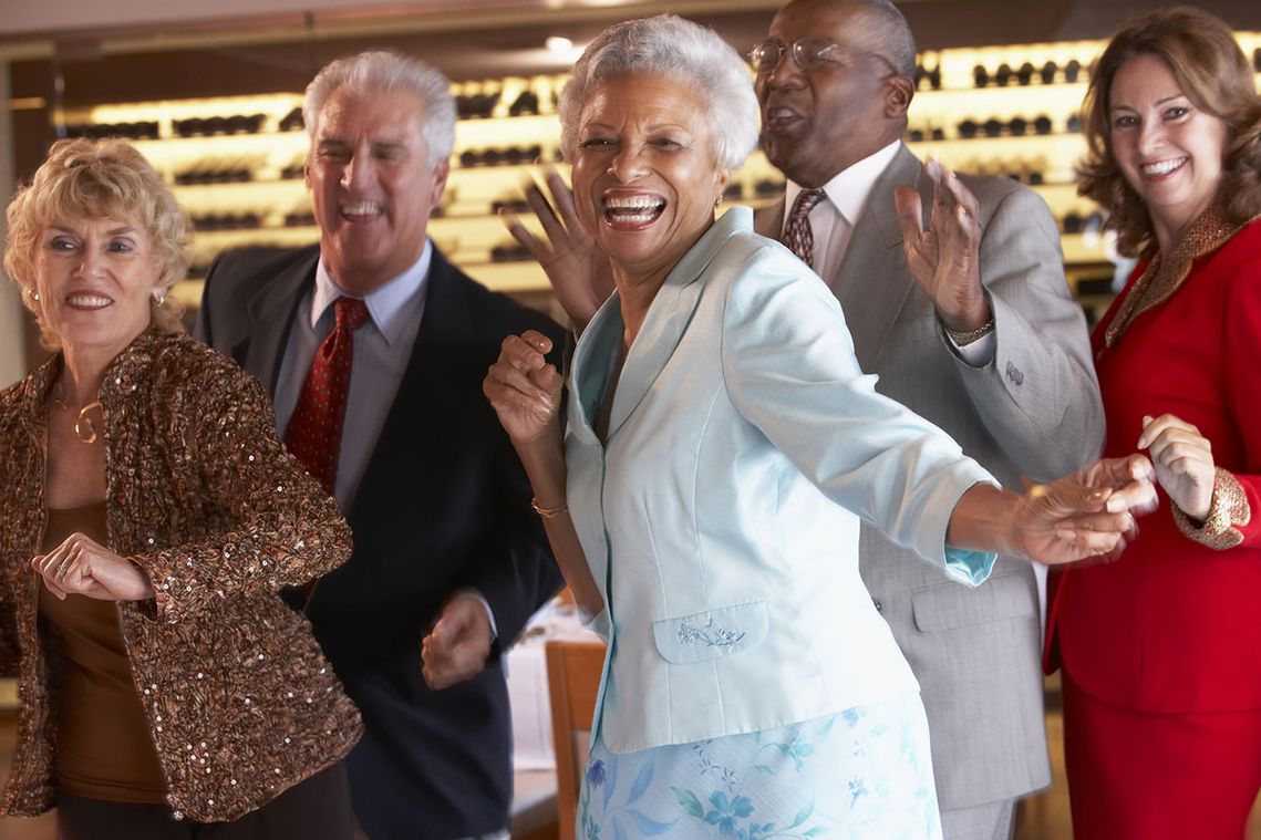 A group of elderly couples dancing